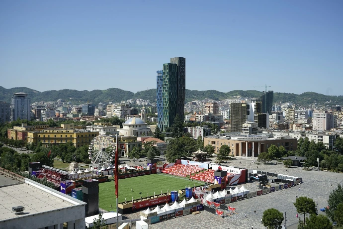 An aerial view of a soccer field in a city
